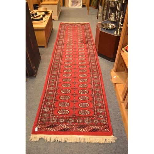 756 - Red ground runner rug, 3.2mx82cm