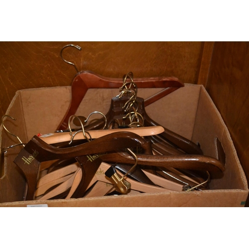 760 - Box of 20 Harrods wooden coat hangers.