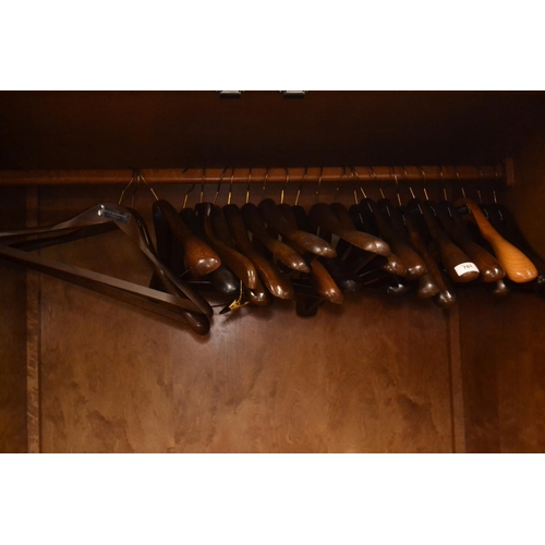 761 - 24 wooden Gieves & Hawkes coat hangers.