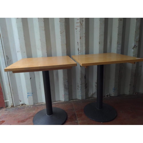 297 - 2 square topped pedestal tables. W61cm h74cm. Some tables have sticker residue that will require cle... 