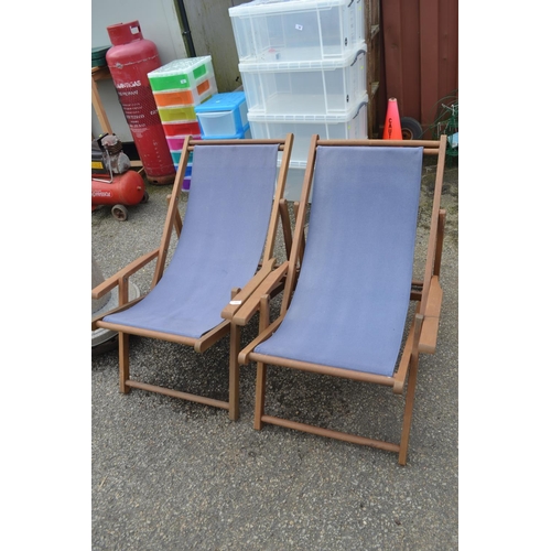 102 - 2 teak framed deck chairs