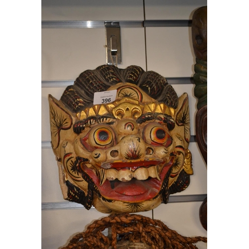 396 - Asian decorative mask. 24cm high