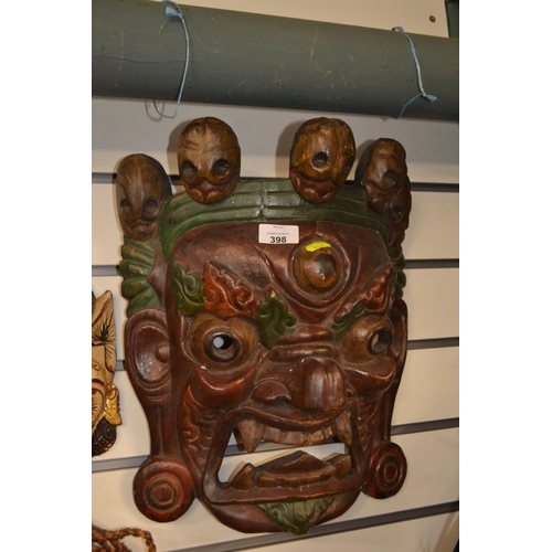 398 - Large Asian decorative mask. Approx. 40cm high