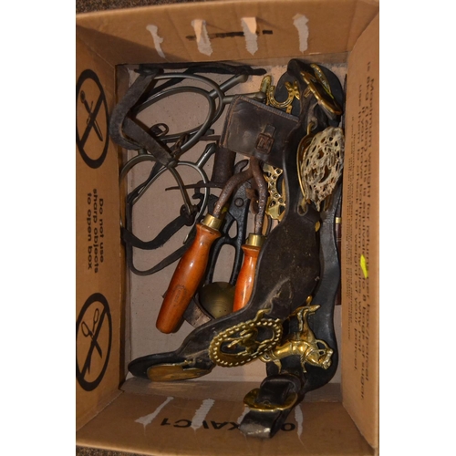 526 - Box of horse brasses, spurs, clippers etc.