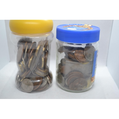 651 - Two jars of assorted coins