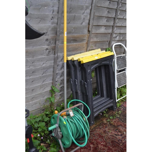 77 - Hose on reel with garden rake