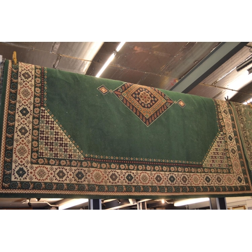 712 - Large emerald green Chinese Garden rug with central medallion 280cm x 380cm