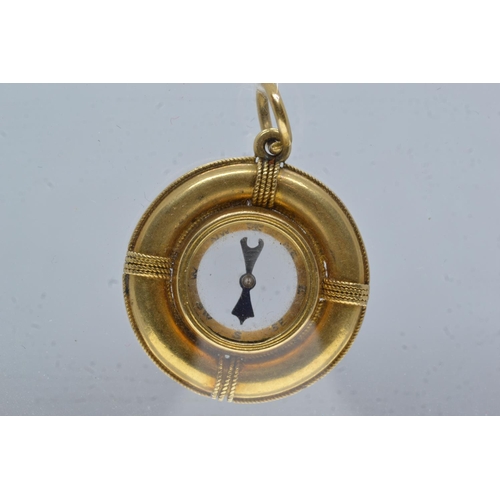 61 - Yellow metal compass charm pendant, tests positive for 9ct gold, 25mm diameter, gross weight 6.38 gr... 