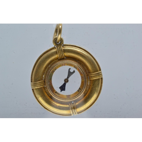 61 - Yellow metal compass charm pendant, tests positive for 9ct gold, 25mm diameter, gross weight 6.38 gr... 