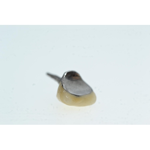 65 - Four gold & teeth crowns, including three white gold & one yellow gold, gross weight 6.07 gr... 