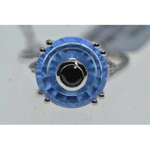 76 - 10ct white gold & blue stone ring, size N1/2, 4 grams