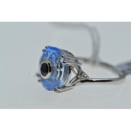 76 - 10ct white gold & blue stone ring, size N1/2, 4 grams