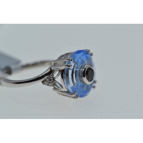 76 - 10ct white gold & blue stone ring, size N1/2, 4 grams