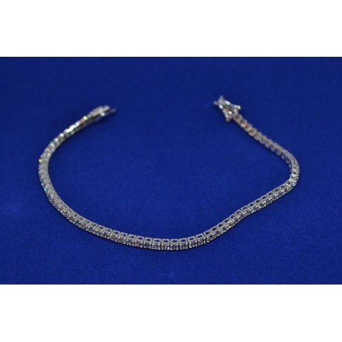 86 - 18ct white gold & 3ct diamond line bracelet, circumference 175mm, 8.13 grams