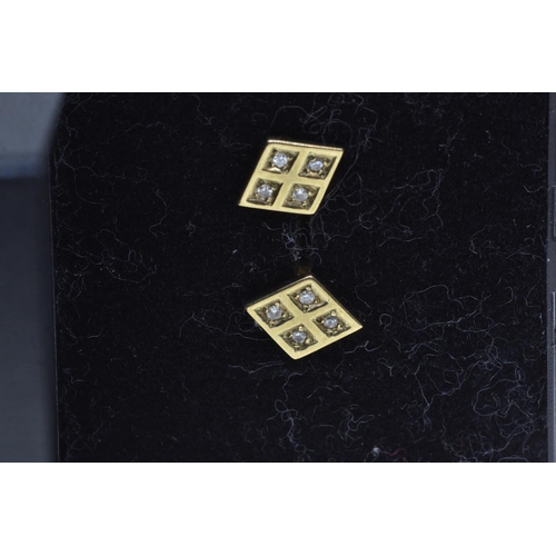 90 - Pair of 9ct gold & diamond ear studs of diamond shape, gross weight 1.76 grams