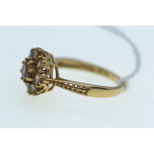 99 - 9ct gold & brown stone cluster ring, size N, 2.51 grams