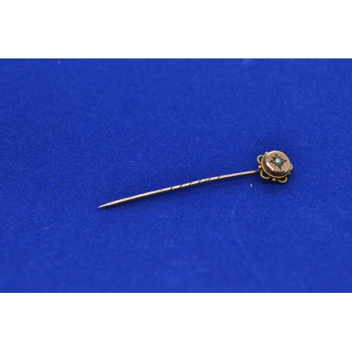 107 - 9ct gold & pearl stick pin, 0.84 gram