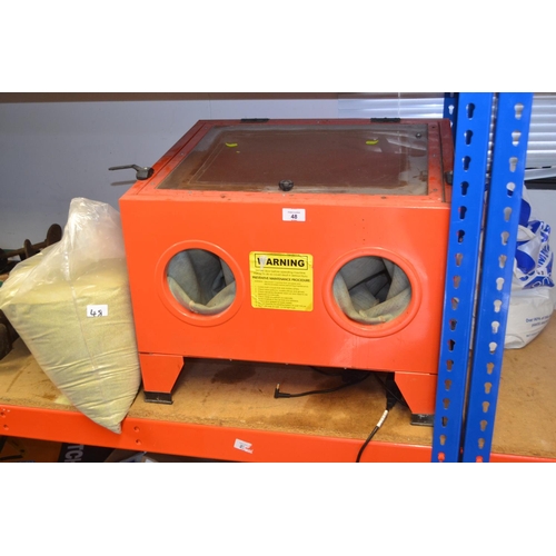 48 - Air-powered sand-blasting box with 2 bags of sand.