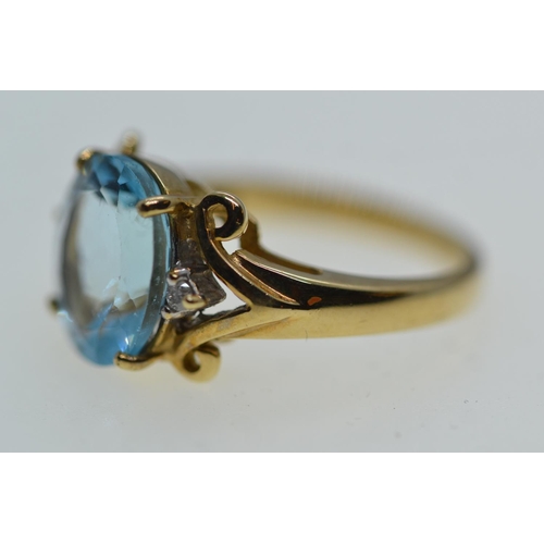 63 - 9ct gold, topaz & diamond ring, size N1/2, 5.2 grams