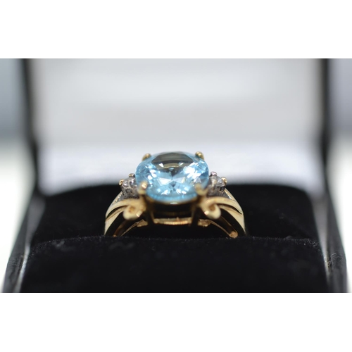 63 - 9ct gold, topaz & diamond ring, size N1/2, 5.2 grams