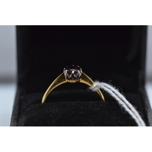 75 - 18ct gold & garnet solitaire ring, size R, 2.65 grams