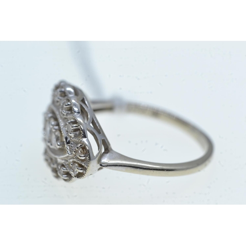 85 - 14ct white gold & diamond cluster ring, size O1/2, 4.42 grams