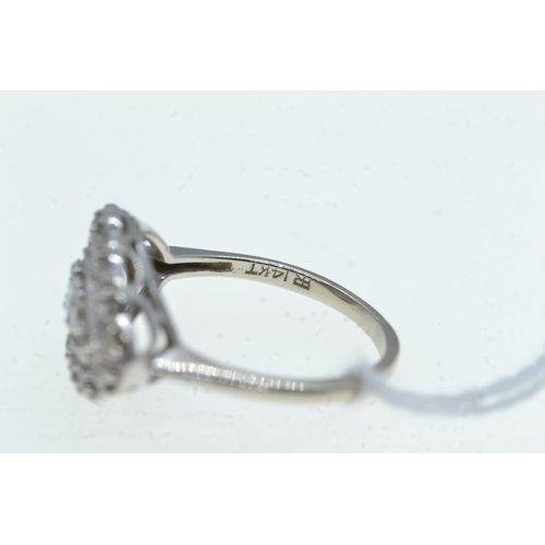 85 - 14ct white gold & diamond cluster ring, size O1/2, 4.42 grams