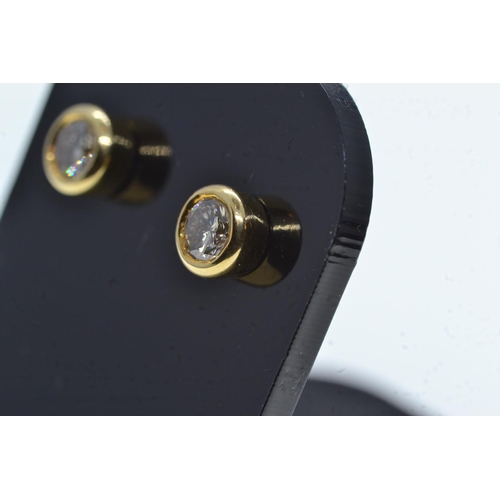 109 - Pair of 18ct gold & diamond ear studs, gross weight 2.26 grams