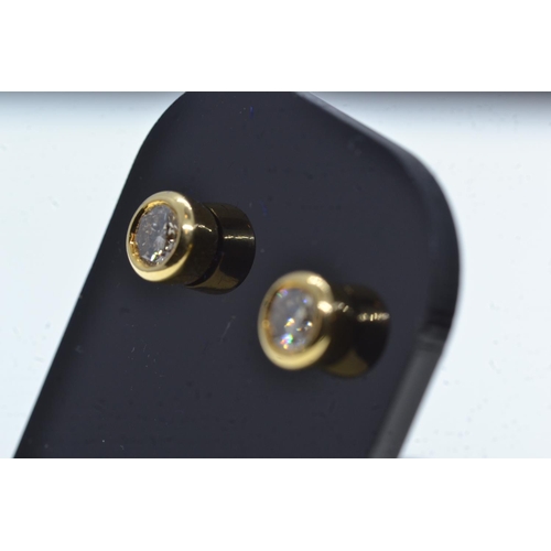 109 - Pair of 18ct gold & diamond ear studs, gross weight 2.26 grams