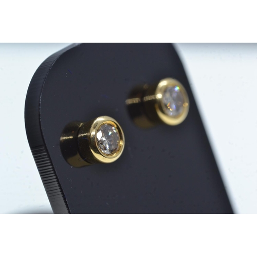 109 - Pair of 18ct gold & diamond ear studs, gross weight 2.26 grams