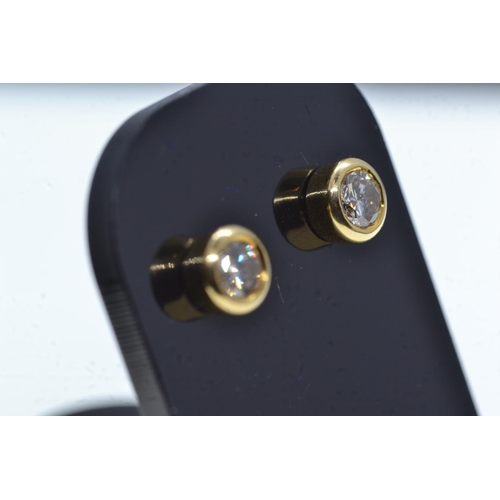 109 - Pair of 18ct gold & diamond ear studs, gross weight 2.26 grams