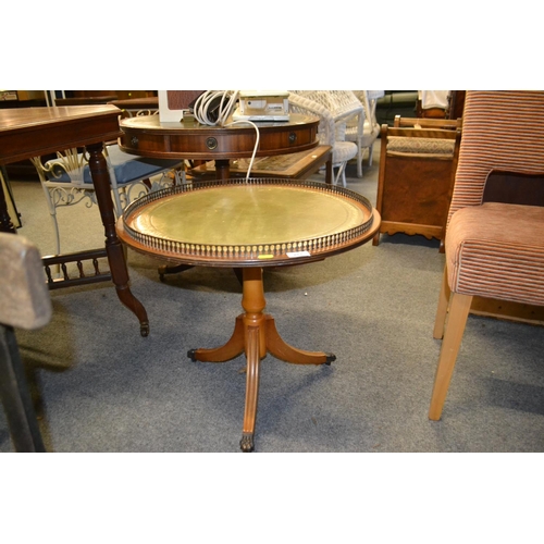 221 - Round pedestal leather topped table with raised gallery D60cm H54cm.