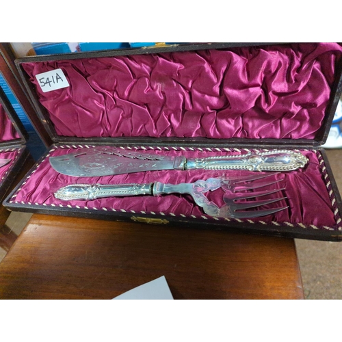 292 - Cased plated pair of fish servers (handles need resecuring) & a cased part fruit fork & knif... 