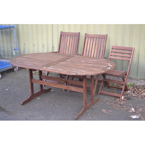 103 - Hardwood outdoor table and wood chairs inc carvers