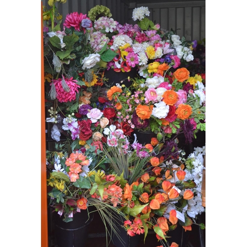 117 - Large quantity of silk flowers on rack including 8 buckets. (Rack not included).