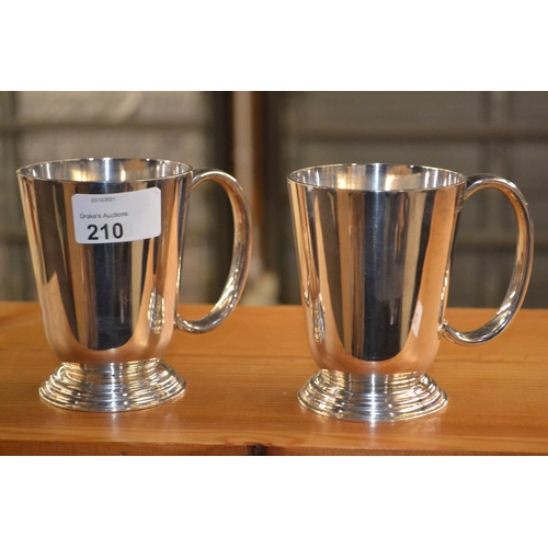 210 - Pair of silver plated half pint tankards