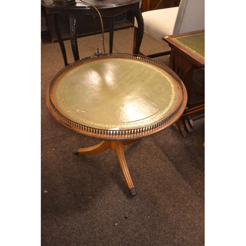 221 - Round pedestal leather topped table with raised gallery D60cm H54cm.