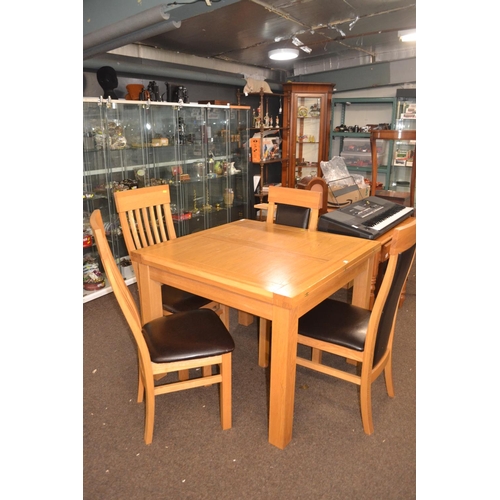 282 - Light oak extending table with 2 pairs of chairs, table 1m square unextended, ht 78cms