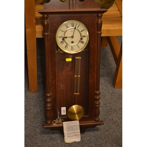 423 - Hermle mahogany wall clock with pendulum and key  H70cm