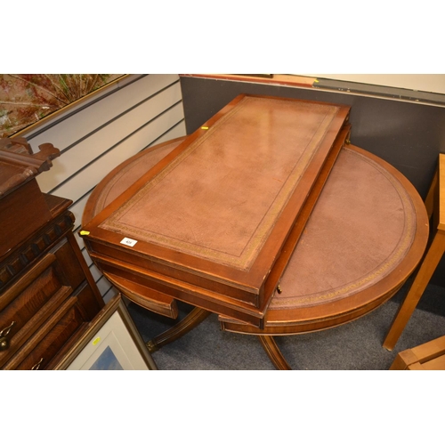 426 - Leather top round drum dinning table with two leaves un-extended W119cm. 