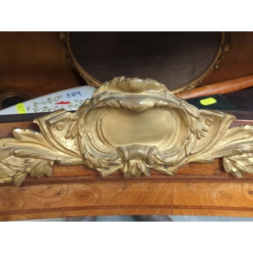 398 - Walnut mantle mirror with ormolu detail. W118cm H60cm