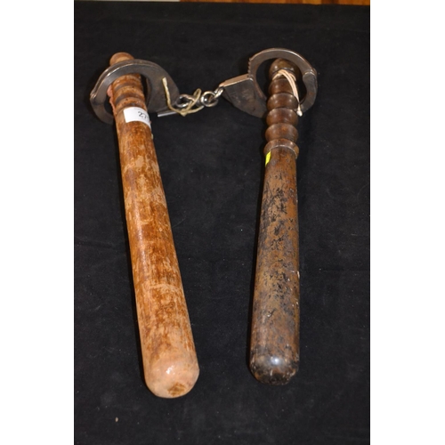 275 - Pair of Hiatts 1960 handcuffs with key & two truncheons