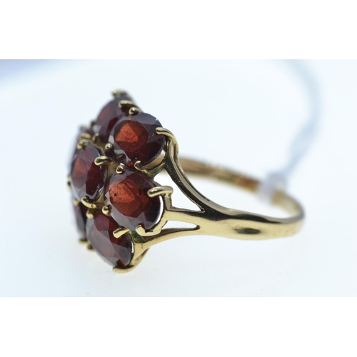 63 - 9ct gold & garnet cluster ring, size R, 5.27 grams