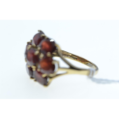 63 - 9ct gold & garnet cluster ring, size R, 5.27 grams