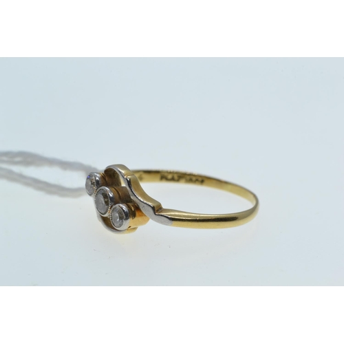 64 - 18ct gold, platinum & three diamond crossover ring, approx. 0.25 carat total, size Q, 2.54 grams