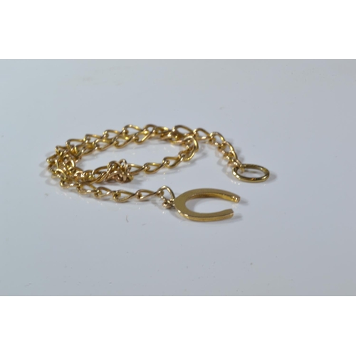 66 - 9ct gold wishbone brooch & a 9ct gold bracelet with horseshoe clasp, gross weight 5.1 grams