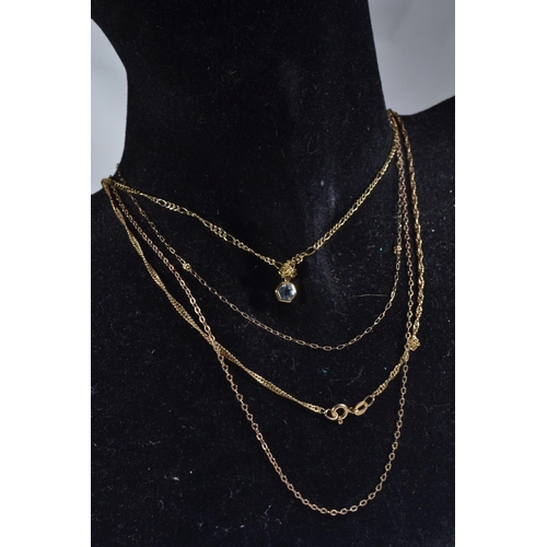 69 - Four 9ct gold neck chains & a gem set pendant, gross weight 6.11 grams