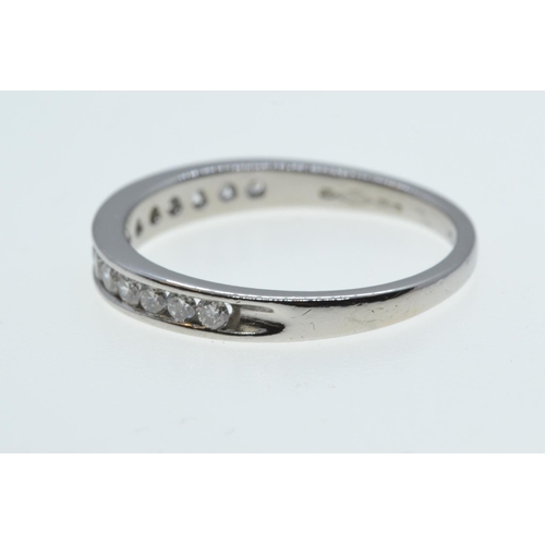 74 - Platinum & diamond half hoop ring, size M, 2.84 grams