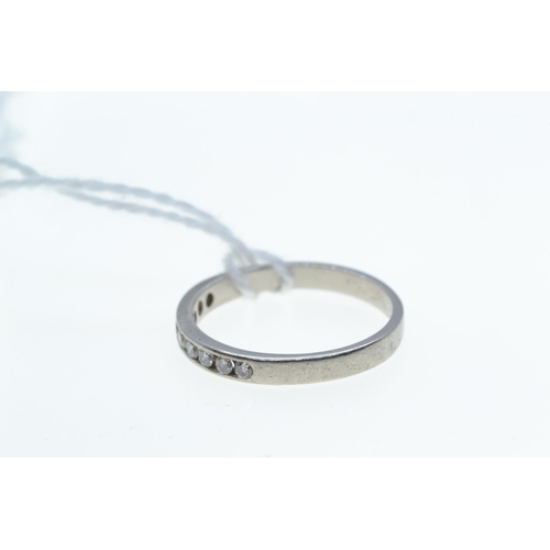 77 - Platinum & diamond half hoop ring, size K, 2.5 grams