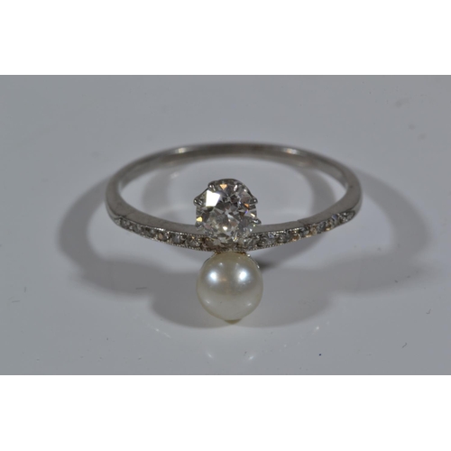 85 - Antique  diamond (.33ct) & pearl ring with channel set diamond shoulders on white metal which te... 